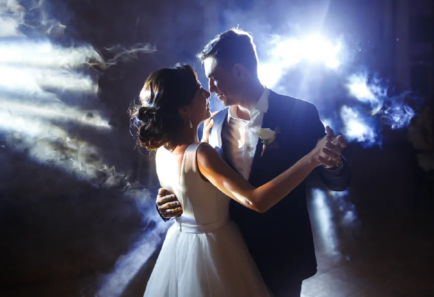 photo of a couple dancing in a dark room during their wedding