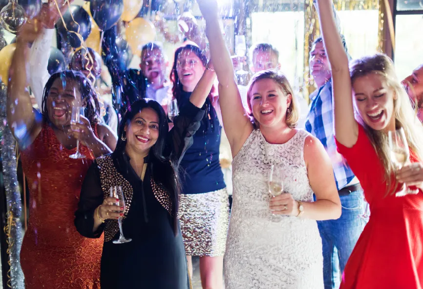 photo of women cheering and celebrating at a private party